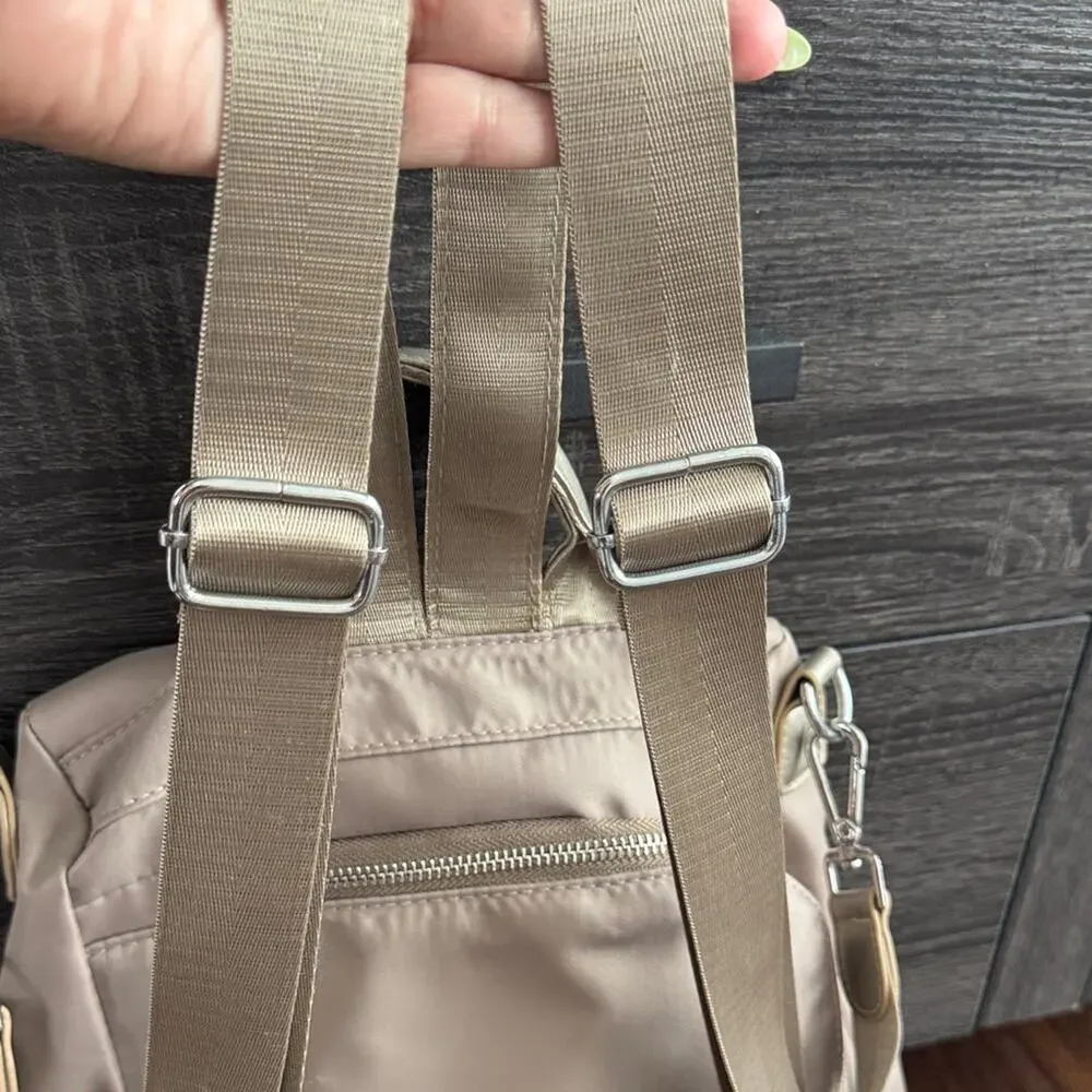 Neutral Taupe Woman’s Backpack with Metallic Accent and many zipper pockets. - Picture 3 of 13
